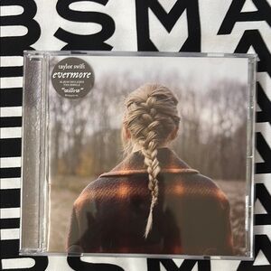 Taylor Swift Evermore Album with Braided Cover